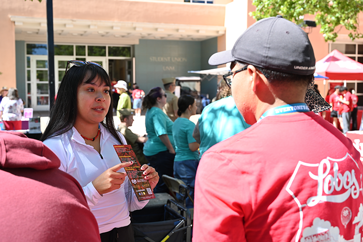 Photo of AISS Advisor answering a question from a UNM student.