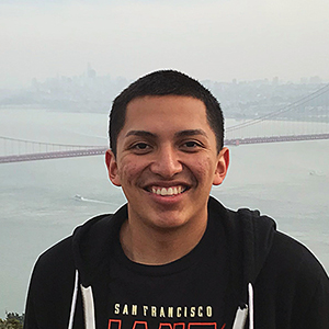 photo of male student with golden gate bridge in the background
